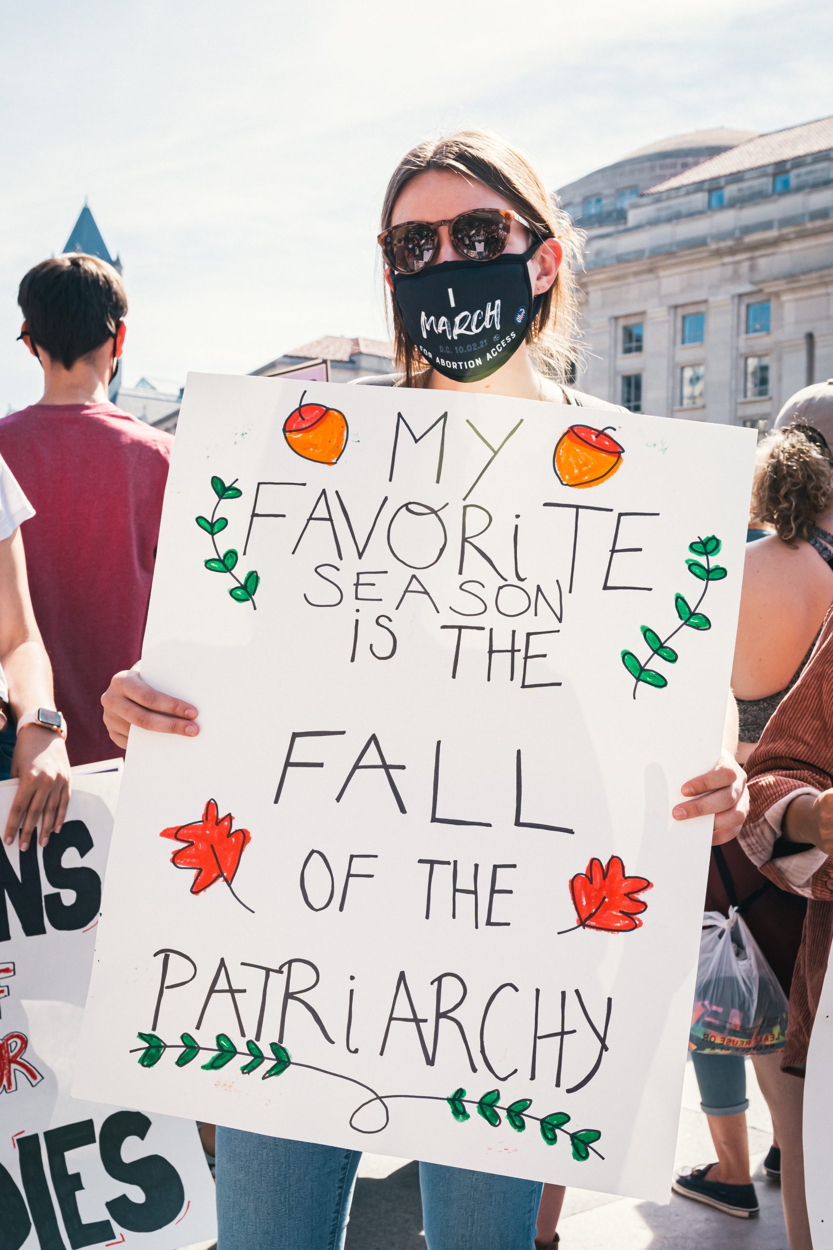 protest sign that says my favorite season is the fall of the patriarchy
