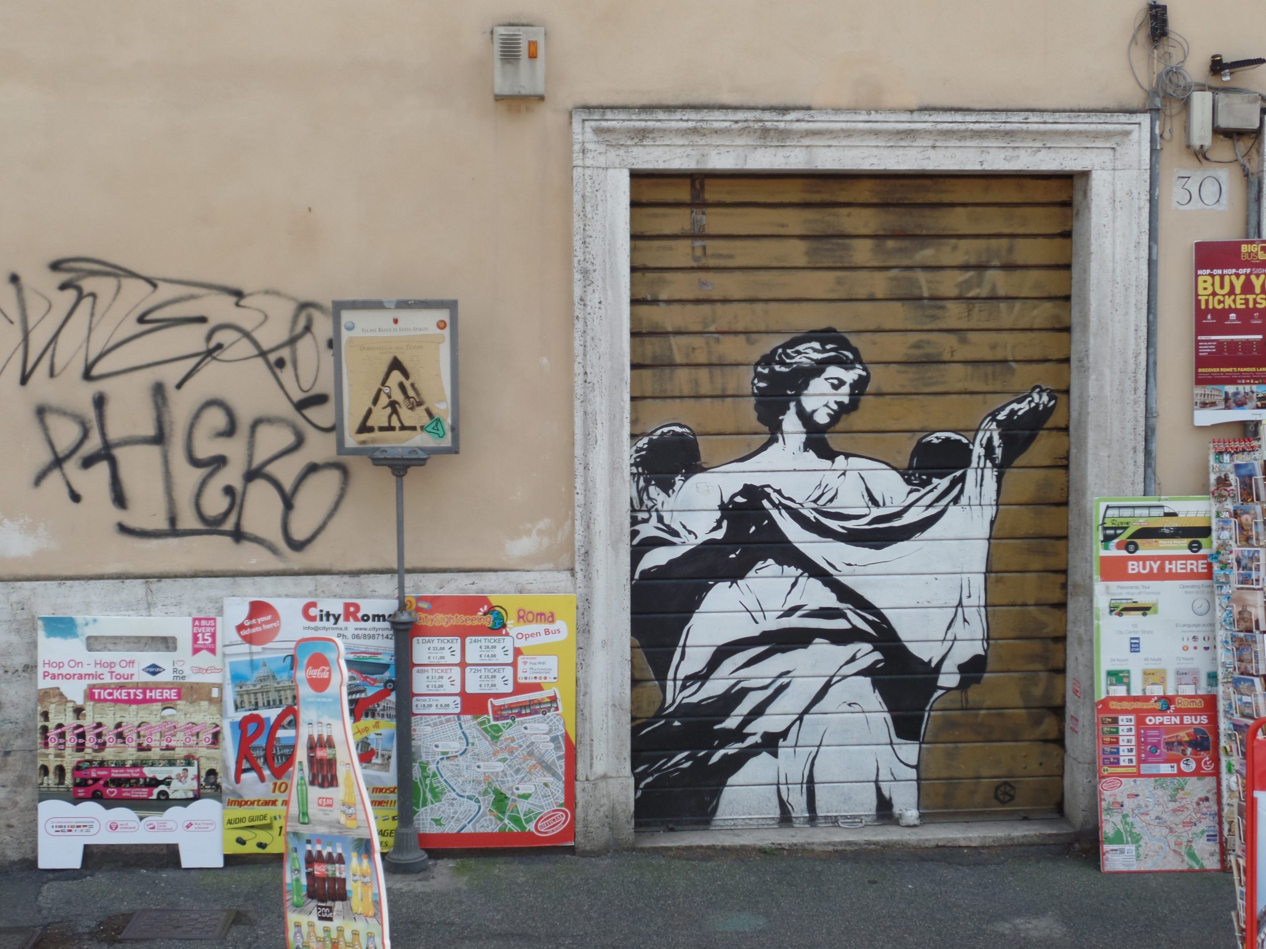 Mural on garage door of an ancient Greek style statue in Rome